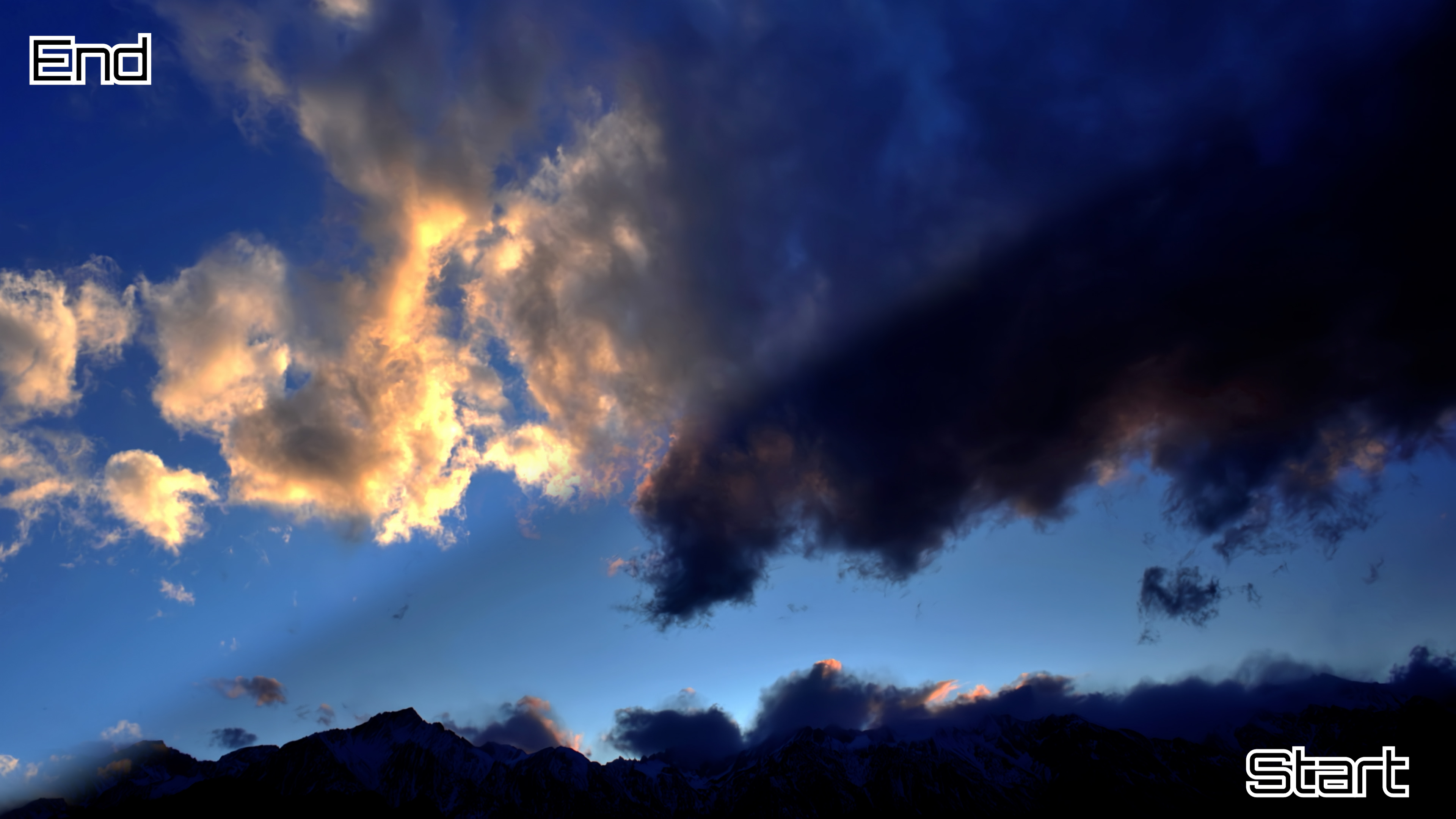 Overhead, complex clouds in the dusk above mountains