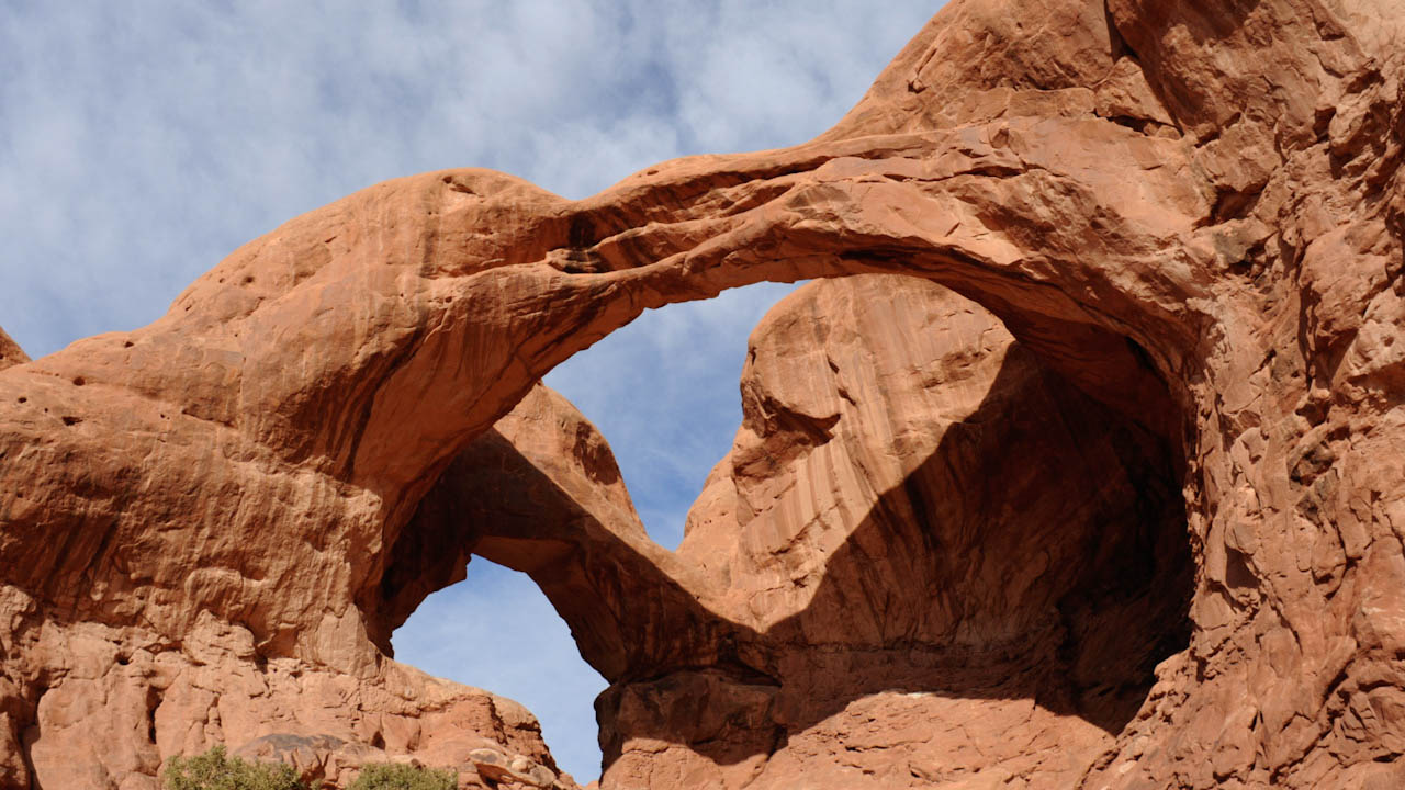 Complex arches under high cirrus clouds