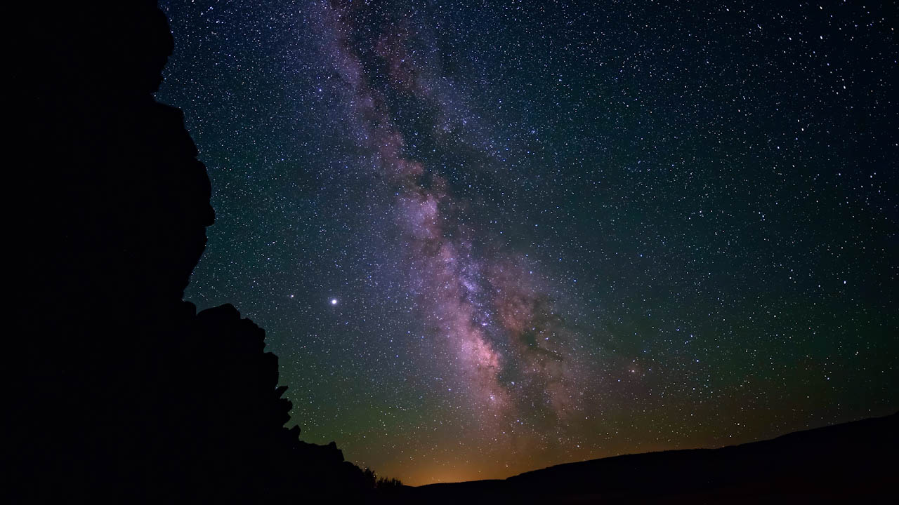 Night sky galaxy with galactic cloud, meteorites, satellites, airplanes