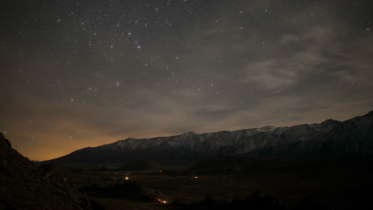 2 of 3 | Low clouds moving at night over mountain range in moonlight