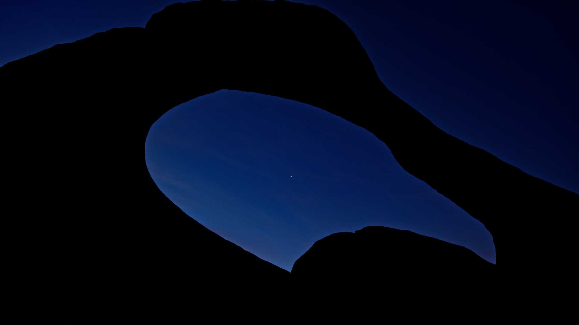 Dusk falls blue over a secret arch near Mt Whitney