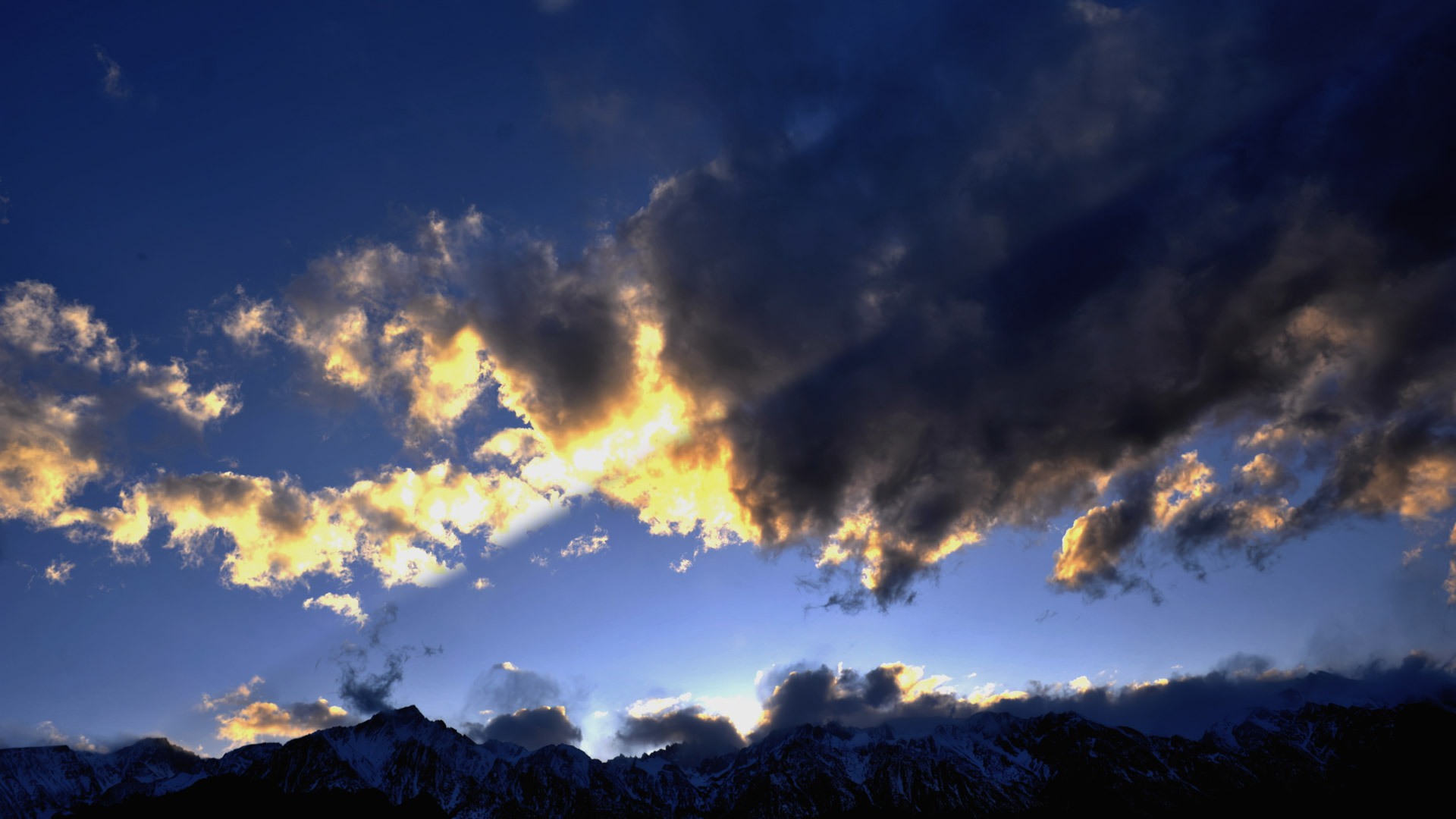 3 of 3 Glowing clouds on the Sierra Nevada floating…