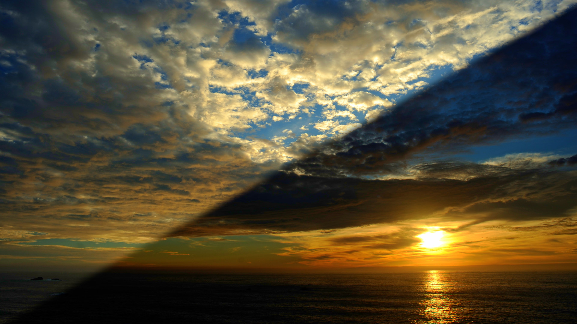 Light from the sun relects off the ocean onto clouds