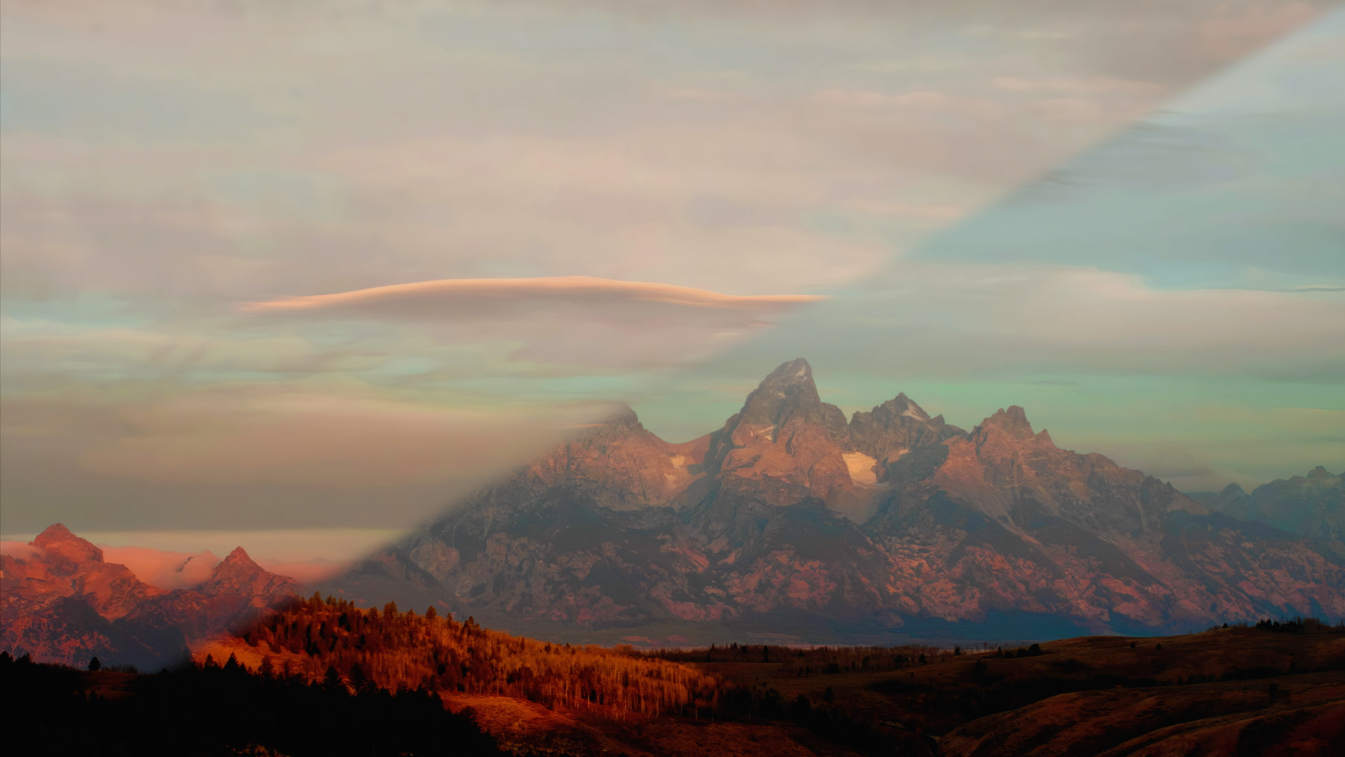 Grand Tetons morning under layers of fair weather and flat clouds brightening