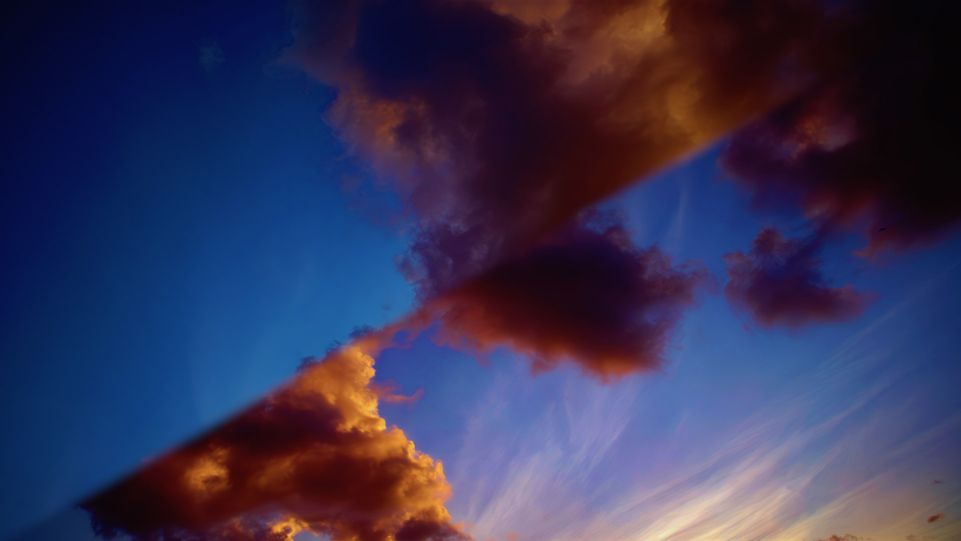 Glowing congestus clouds rambling at sunset, tall…