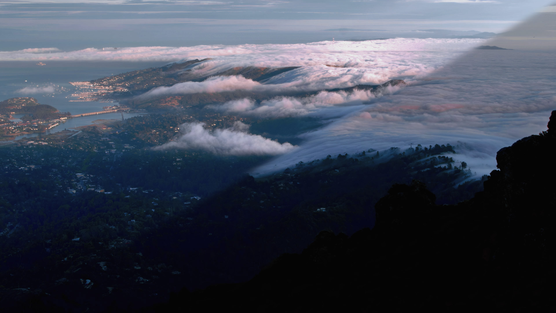 Marine layer over hills that are blanketing