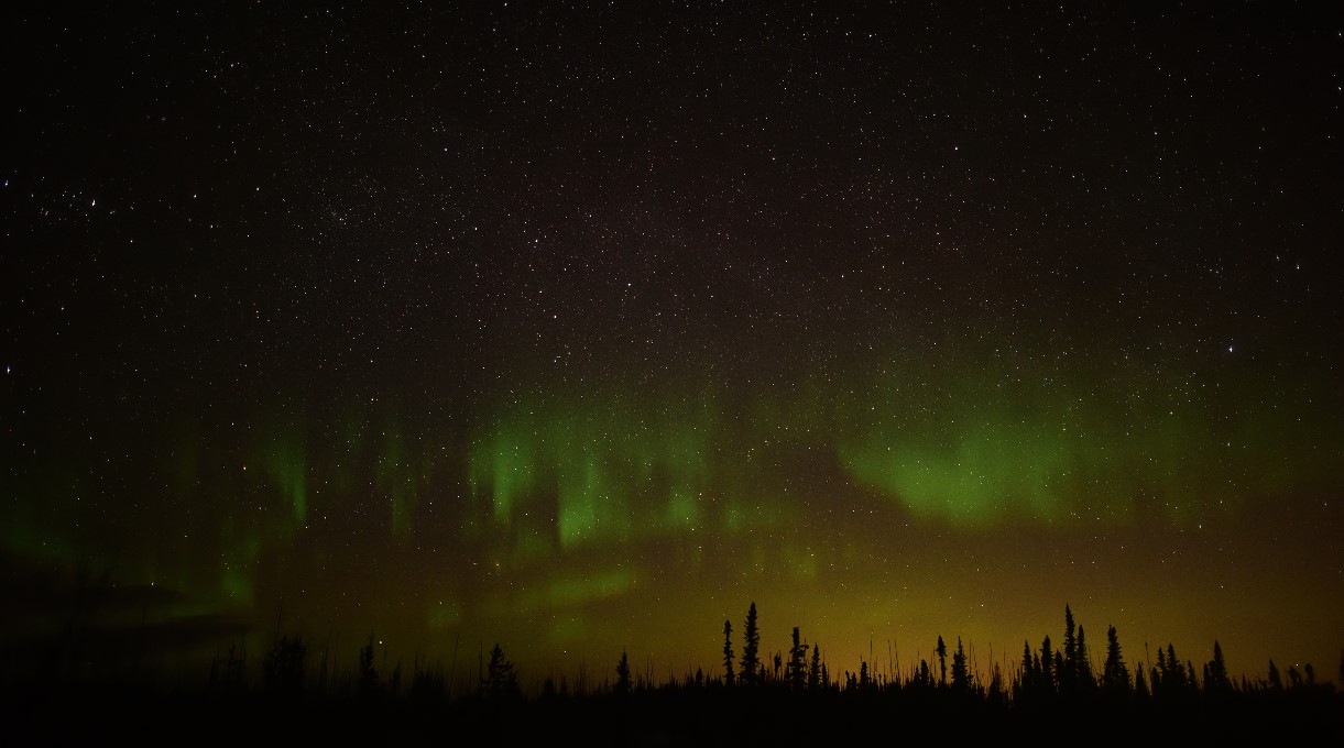 Aurora Borealis float slowly in the distant sky